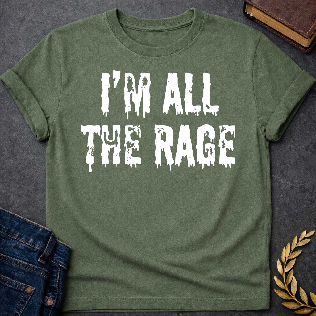 Military Green T-shirt graphic in white featuring large dripping horror-style text reading "I'm All the Rage" — a double entendre playing on both popular trends and the furious wrath of Ares, the Greek God of War, rendered in a distressed melting font
