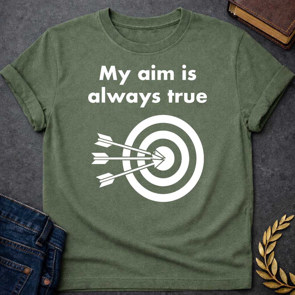 Military Green T-shirt graphic At the top, the phrase "My aim is always true" is written in a bold, white, sans-serif font across two lines. Below the text is a black and white bullseye target icon. Three white arrows are shown striking the center of the target simultaneously from the left, with their points clustered directly in the "dead center" inner circle