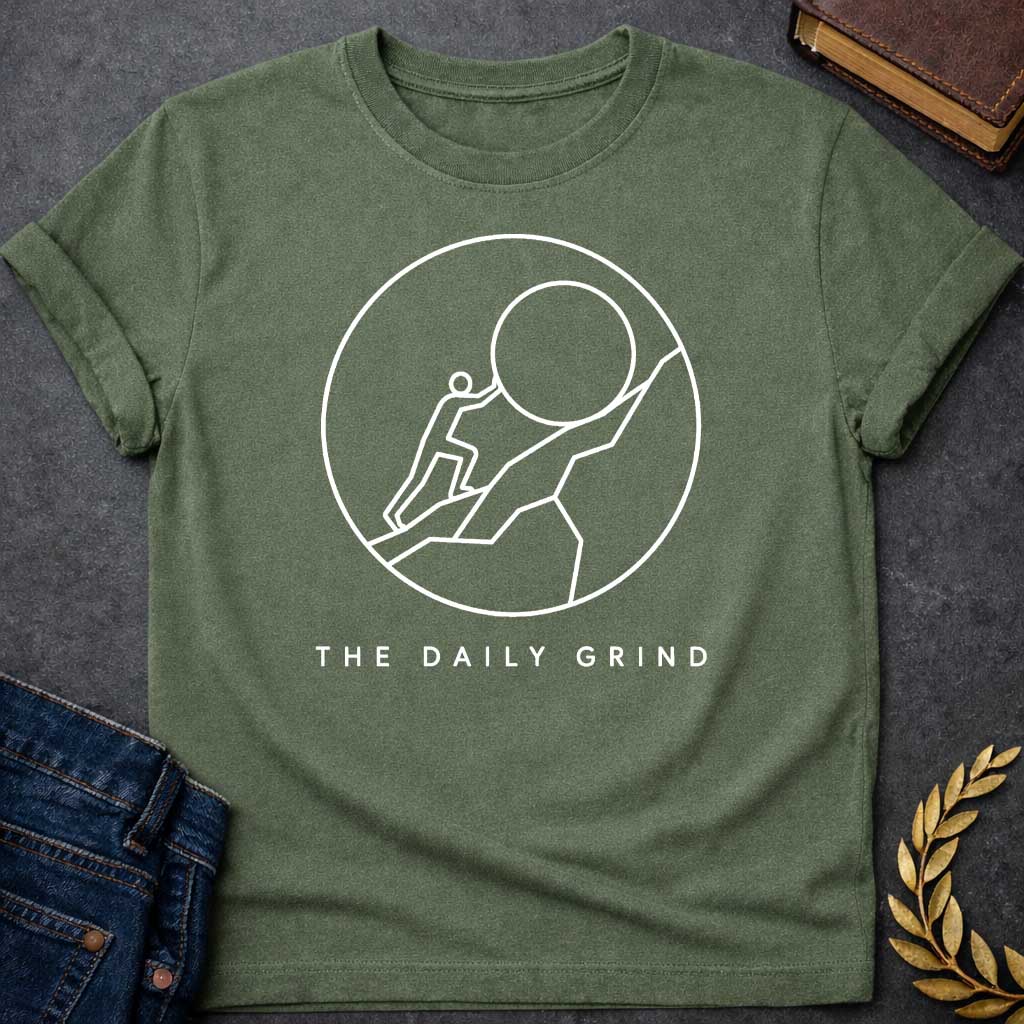 Military Green T-Shirt with a minimalist white graphic design.  Inside a thin circle is a simple line-art illustration of a stick figure pushing a large boulder up a steep hill, representing the myth of Sisyphus. Below the circle, the text reads "THE DAILY GRIND" in a clean, sans-serif font.