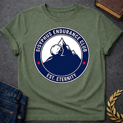 Military Green T-Shirt with a circular, emblem-style graphic design. The center features a dark blue silhouette of a mountain with a large boulder resting near the peak. Surrounding this illustration is a dark blue ring with white text that reads "SISYPHUS ENDURANCE CLUB" arched at the top and "EST. ETERNITY" at the bottom, with two small red dots separating the text on the sides.