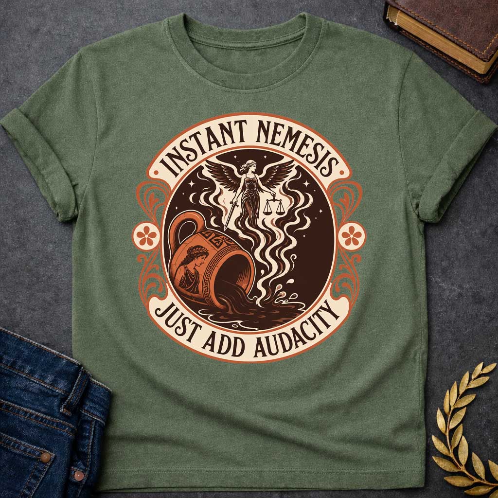 Military Green T-shirt with a Vintage product-label style circular design in terracotta, cream, and dark brown. Text reads 'INSTANT NEMESIS' at top and 'JUST ADD AUDACITY' at bottom. Center features Nemesis, the winged Greek goddess of retribution, holding scales of justice above a spilling Greek vase with a classical Greek warrior profile. Swirling smoke rises from the vessel. Ornate Art Nouveau flourishes and floral medallions frame the design. Humorous take on Greek mythology and divine consequences.