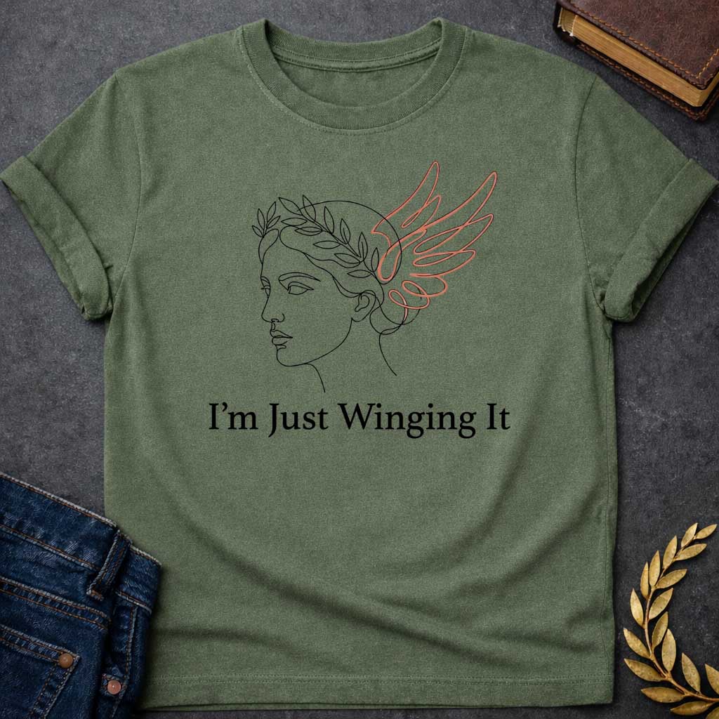Military Green T-shirt with a Minimalist line art illustration of a classical Greek profile with a laurel wreath crown and large terracotta-colored wings extending from the head. Elegant continuous line drawing style. Text reads 'I'm Just Winging It' in serif font below. References Nike, the goddess of victory, with a humorous modern spin. Blends classical mythology with relatable contemporary humor about improvisation and navigating life without a plan.