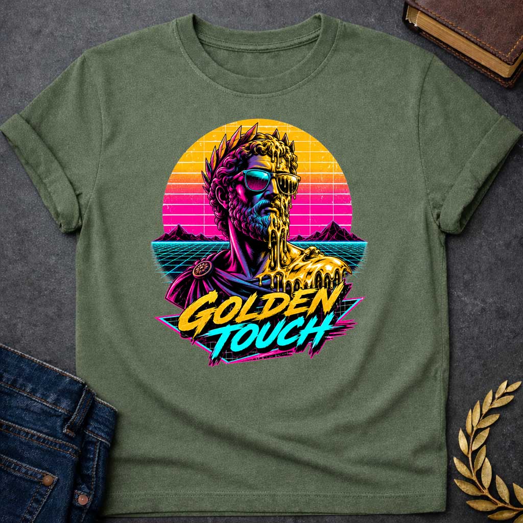 Military Green t-shirt with A Retro synthwave-inspired Greek mythology design featuring a stylized bust of King Midas wearing sunglasses as molten gold drips over half his face and shoulder. A vibrant neon sunset, grid landscape, and mountains create an 80s vaporwave backdrop. Bold brush lettering reads "Golden Touch" in gold and teal, using bright pink, purple, cyan, and gold for a striking vintage aesthetic.