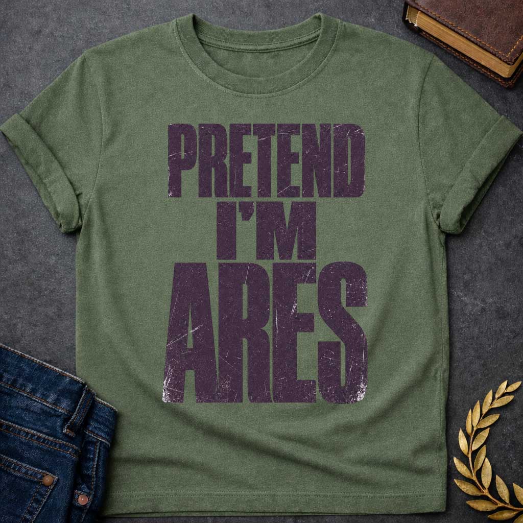 Military Green t-shirt with a Pretend I’m Ares Greek mythology design featuring bold distressed purple typography on a transparent background. The stacked text reads “PRETEND I’M ARES” in a rugged vintage block font, creating a humorous Greek god design inspired by Ares, the god of war, courage, battle, and martial strength.