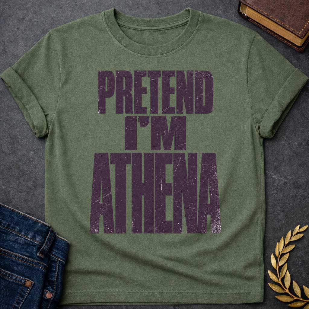 Military Green t-shirt with a Pretend I’m Athena Greek mythology design featuring bold distressed purple typography on a transparent background. The stacked text reads “PRETEND I’M ATHENA” in a rugged vintage block font, creating a humorous design inspired by Athena, the Greek goddess of wisdom, warfare, strategy, and crafts.
