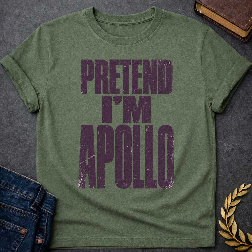 Military Green t-shirt with a Pretend I’m Apollo Greek mythology design featuring bold distressed purple typography on a transparent background. The stacked text reads “PRETEND I’M APOLLO” in a rugged vintage block font, creating a simple humorous design inspired by Apollo, the Greek god of the sun, music, poetry, prophecy, and healing.