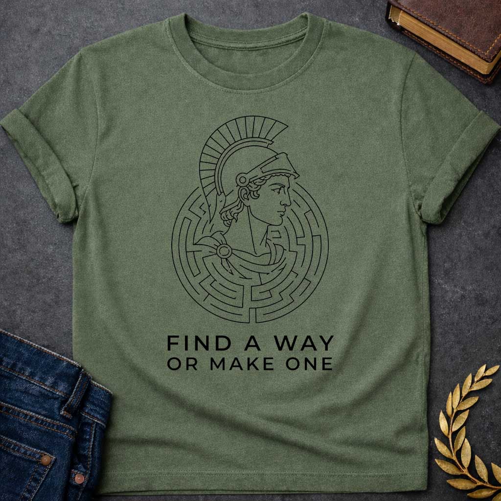 Military Green T-shirt with A Classical profile of a Spartan warrior wearing a crested Corinthian helmet, surrounded by concentric circular maze patterns forming an intricate labyrinth. Black and white line art style. Text reads 'Find A Way Or Make One' below. Motivational design celebrating determination, problem-solving, and perseverance. References Theseus's escape from the mythological Cretian labyrinth while embodying warrior resilience and grit.