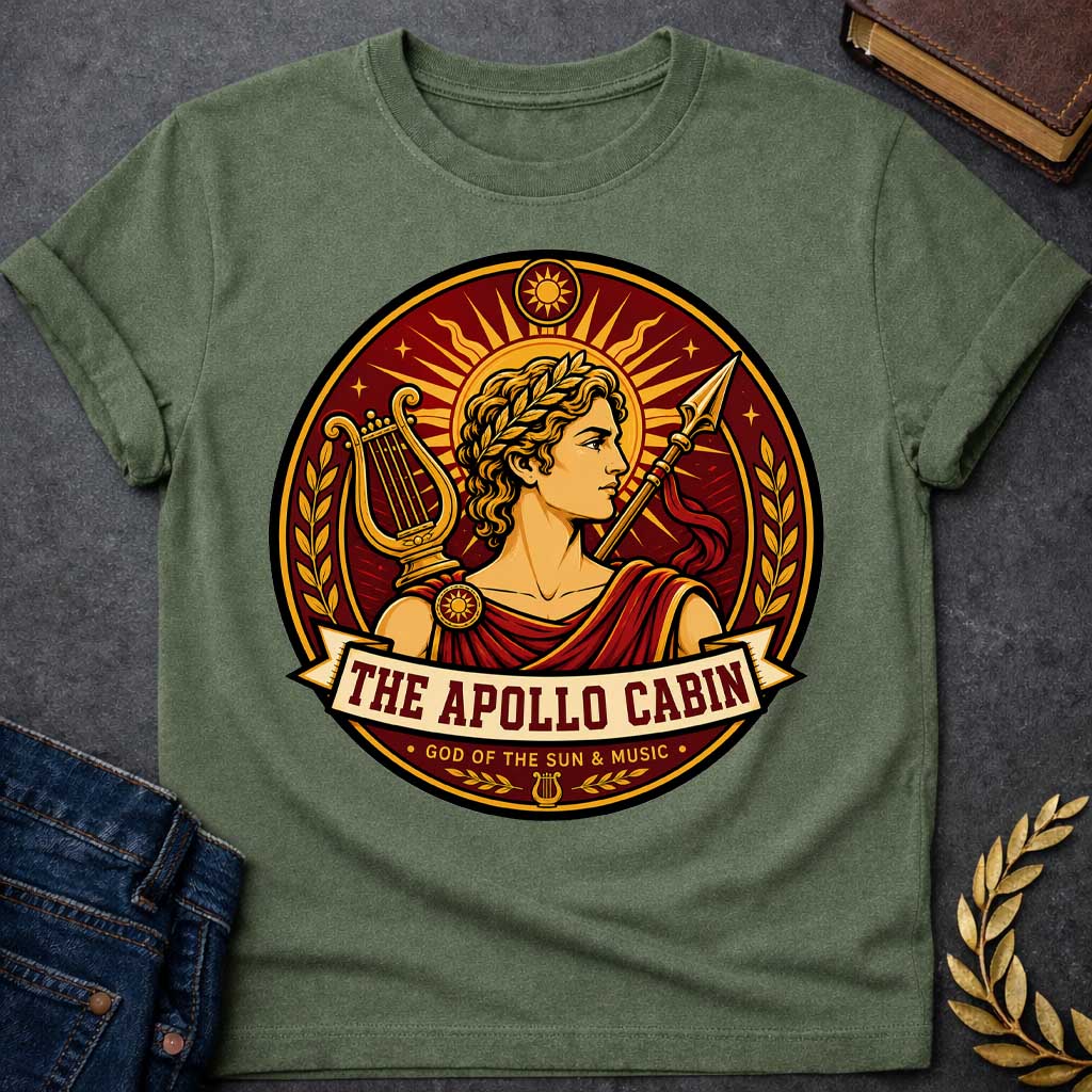 Military Green t-shirt with a Apollo Greek mythology cabin design featuring the god of the sun and music wearing a golden laurel crown, framed by a radiant sun, lyre, spear, stars, and laurel branches. Rich red, gold, and cream circular camp-style emblem includes the text “The Apollo Cabin” and “God of the Sun & Music.