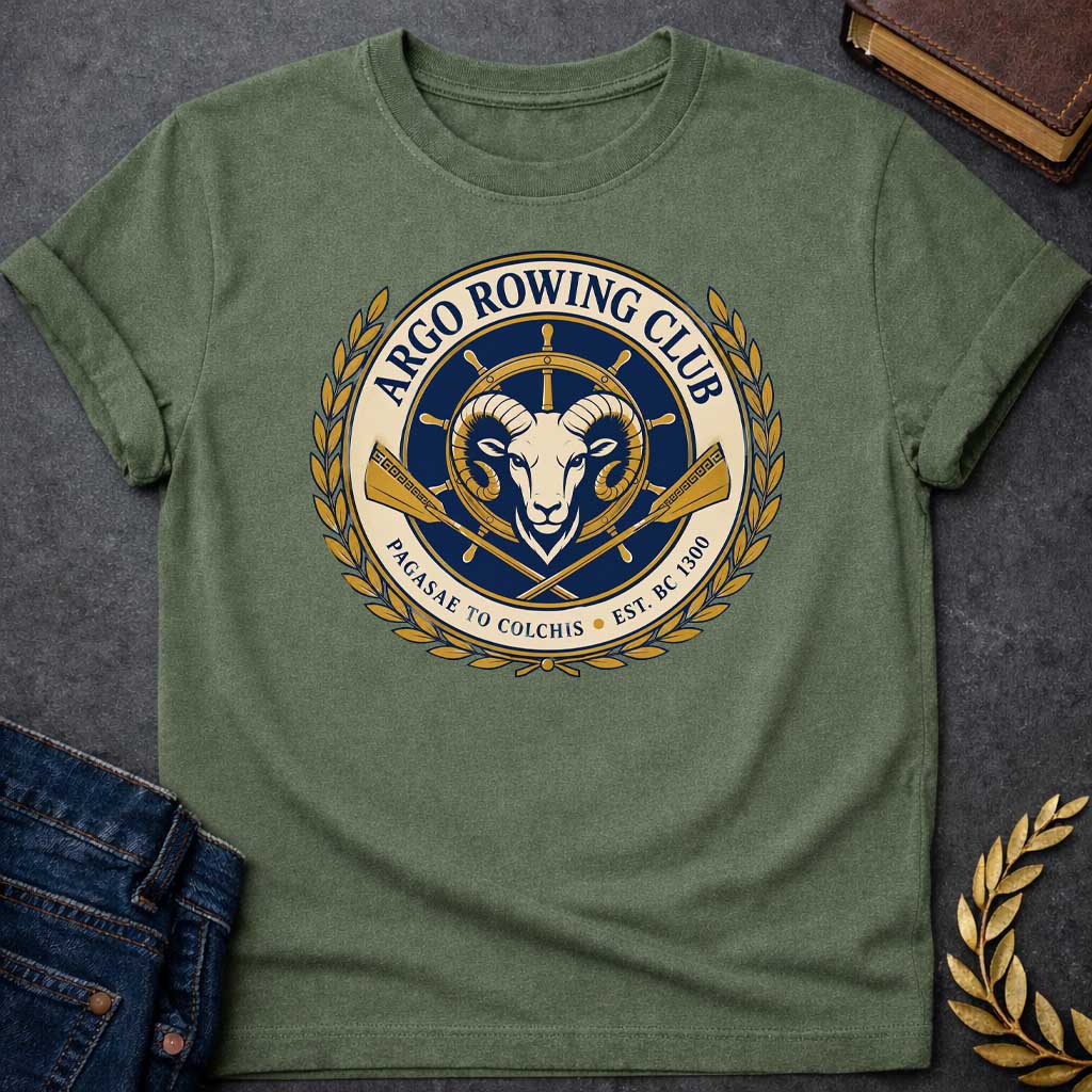 Military Green T-shirt with A Nautical emblem of Argo Rowing Club in navy and gold featuring a golden ram's head at center, representing the mythological golden fleece. A ship's wheel rises above, flanked by crossed oars with Greek key patterns. Laurel wreaths frame the circular design. Text reads 'Argo Rowing Club' and 'Pacasae to Colchis Est. BRC 1300.' Celebrates the legendary quest of Jason and the Argonauts with modern rowing club aesthetics and classical maritime imagery.