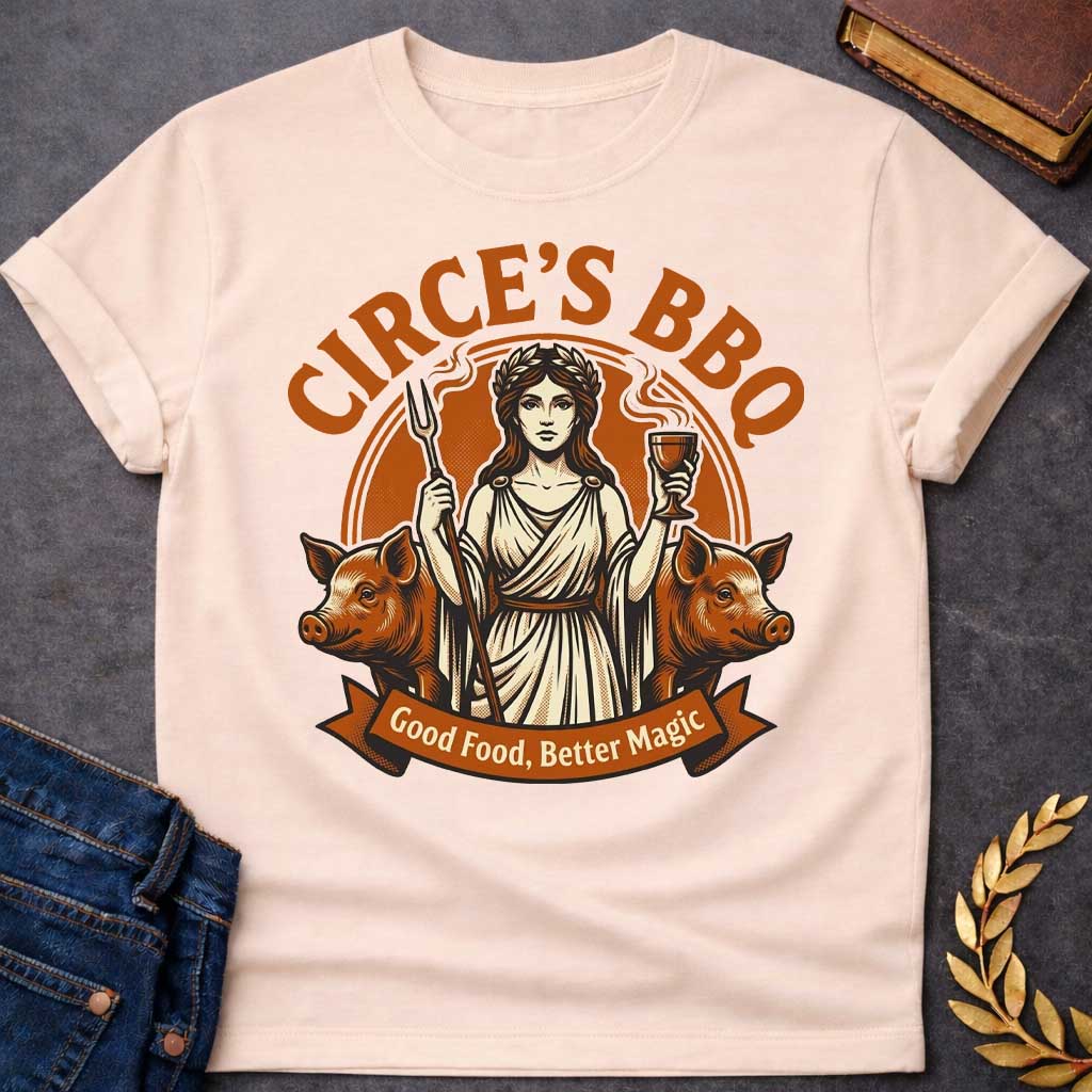 Natural T-shirt with a Humorous BBQ restaurant emblem featuring Circe from Greek mythology in classical robes. She holds a trident fork and wine goblet. Two pigs flank her sides, representing her legendary power to transform men through magic and enchantment. Brown and cream aesthetic. Text reads 'Circe's BBQ' and 'Good Food, Better Magic.' Clever wordplay merges ancient witchcraft with modern barbecue culture and humorous transformation themes.