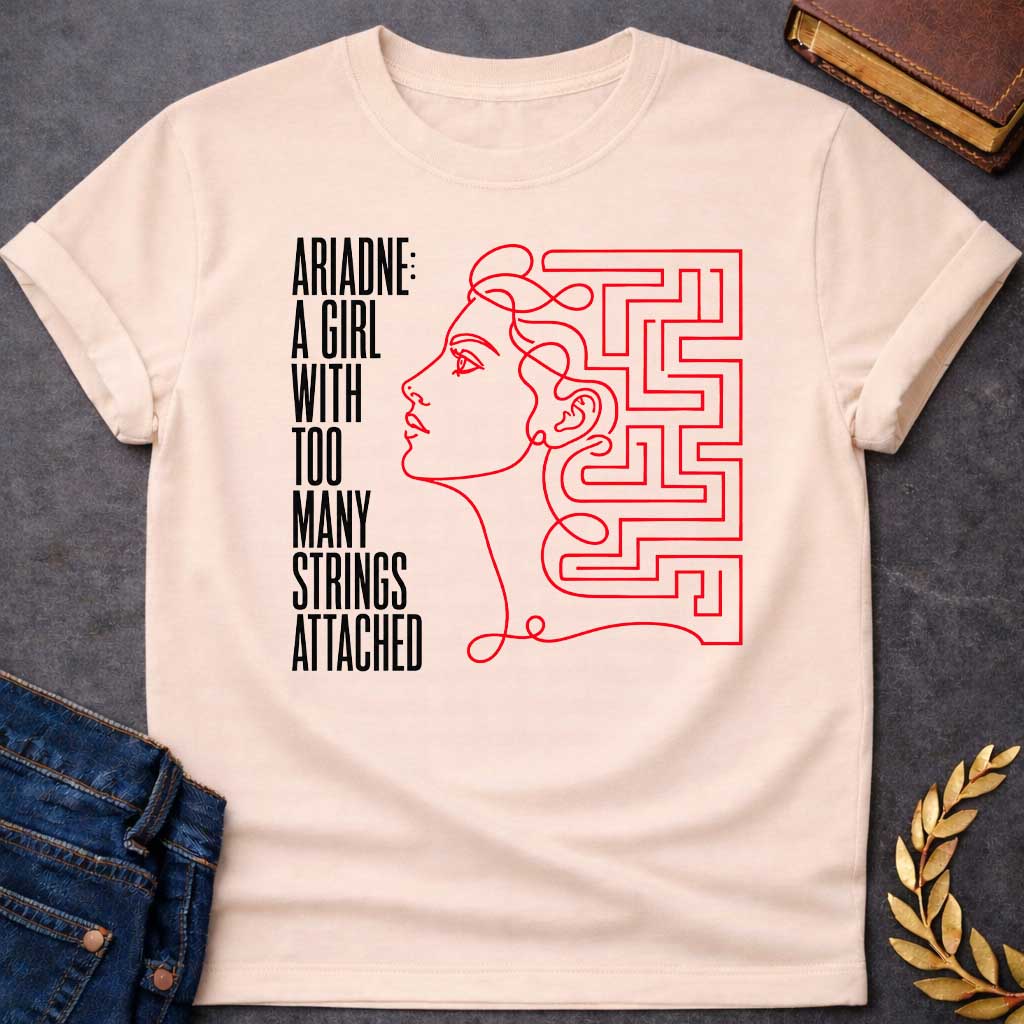 Natural T-shirt with A minimalist, modern line art t-shirt design for "ariadne a girl with black.jpg". Drawn in a single, continuous red line, the profile of a woman’s face seamlessly transitions into a geometric labyrinth maze behind her head. To the left, stark, vertically elongated black block text stacked vertically reads: "ARIADNE: A GIRL WITH TOO MANY STRINGS ATTACHED," creating a clever Greek mythology pun.