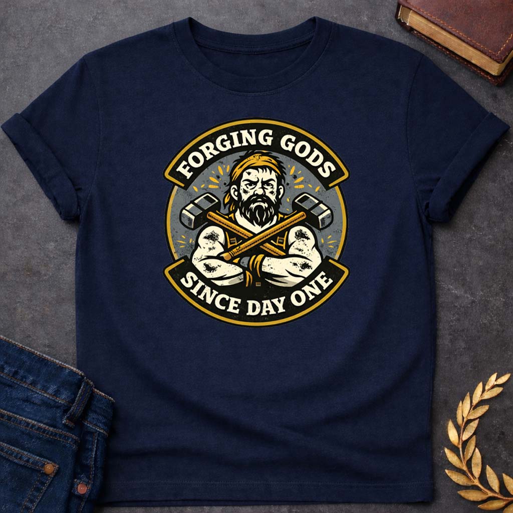 Hephaestus Forging Gods Since Day One Greek Mythology Adult T-Shirt featuring blacksmith hammer, forge sparks, fire god symbolism in industrial mythology design