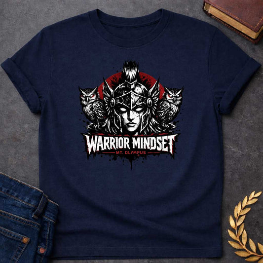 Navy T-shirt graphic in a dark, intense ink style featuring a front-facing illustration of Athena in a winged helmet against a deep red circle, flanked by two owls with glowing red eyes. Bold distressed text below reads "Warrior Mindset" with "Mt. Olympus" in red underneath, in a heavy metal-inspired Greek mythology design rendered in black, white, and red