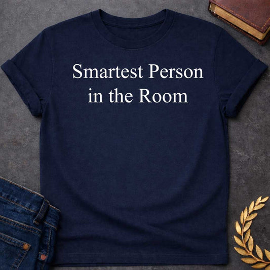 Navy T-shirt graphic in white featuring large elegant serif text reading "Smartest Person in the Room" — a confident nod to Athena, the Greek Goddess of Wisdom