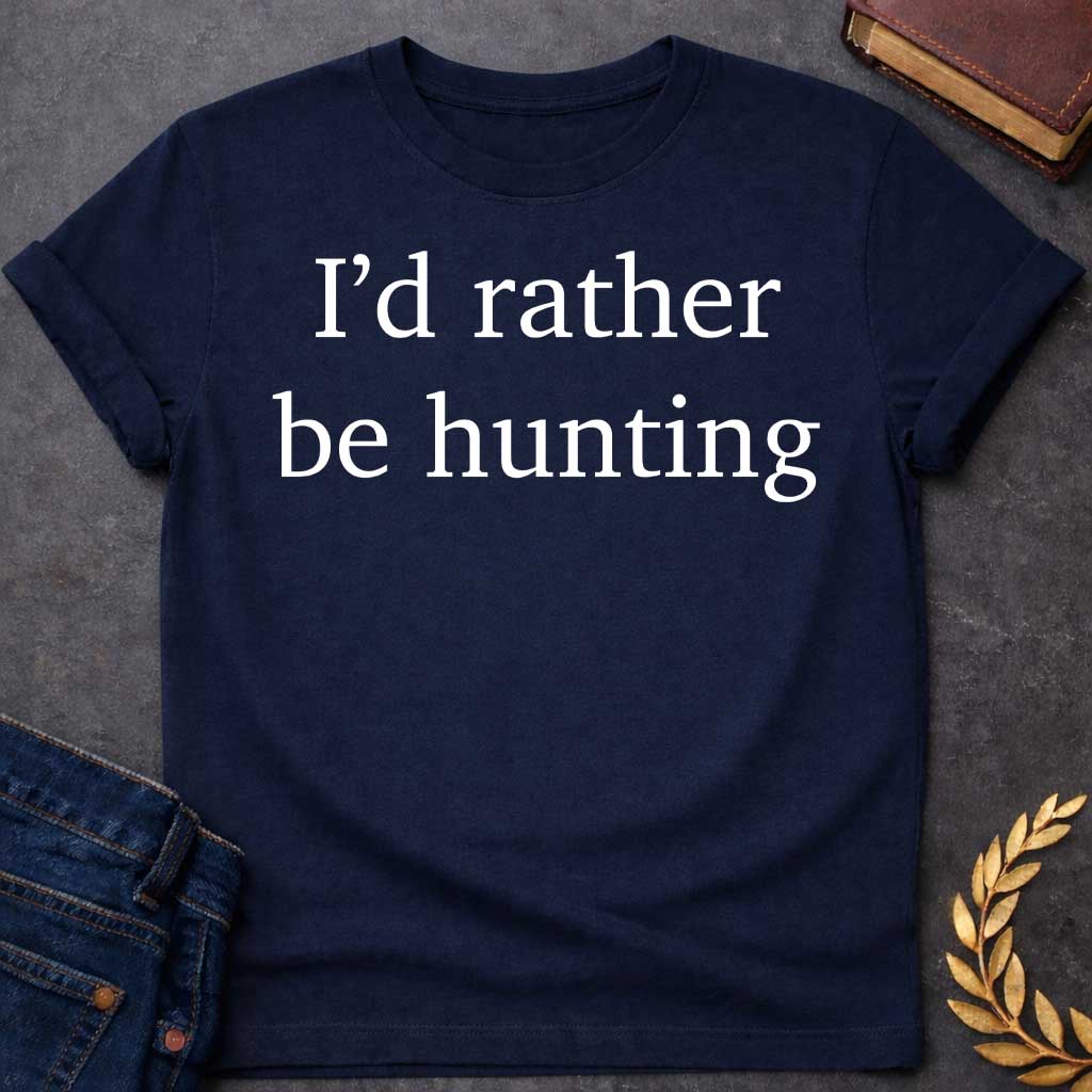 Navy T-shirt graphic white featuring large clean serif text reading "I'd rather be hunting" — a humorous nod to Artemis, the Greek Goddess of the Hunt