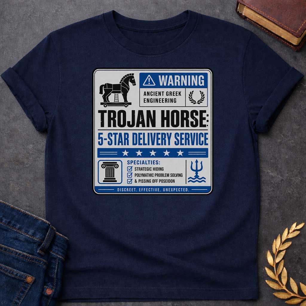 Navy T-shirt with a graphic designed as a humorous official-style warning sign in grey, blue, and black featuring a flat Trojan Horse icon with a blue warning triangle and the text "Warning — Ancient Greek Engineering" and a laurel wreath in the top section. Bold text reads "Trojan Horse: 5-Star Delivery Service" above a blue five-star rating banner. A checklist below under "Specialties:" reads "Strategic Hiding, Polymathic Problem Solving, & Pissing Off Poseidon" flanked by a Greek column icon and a Poseid