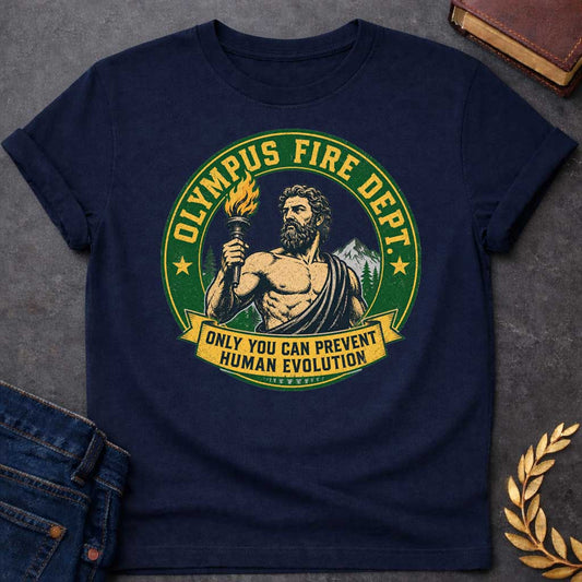 Navy T-shirt with A satirical national park style badge featuring Prometheus or Zeus holding a burning torch. The central vector portrait is set against mountains and pine trees. A distressed green circular frame reads "OLYMPUS FIRE DEPT." in a bold yellow font flanked by two stars. A yellow banner draped across the bottom features the humorous tagline: "ONLY YOU CAN PREVENT HUMAN EVOLUTION" in clean block letters.