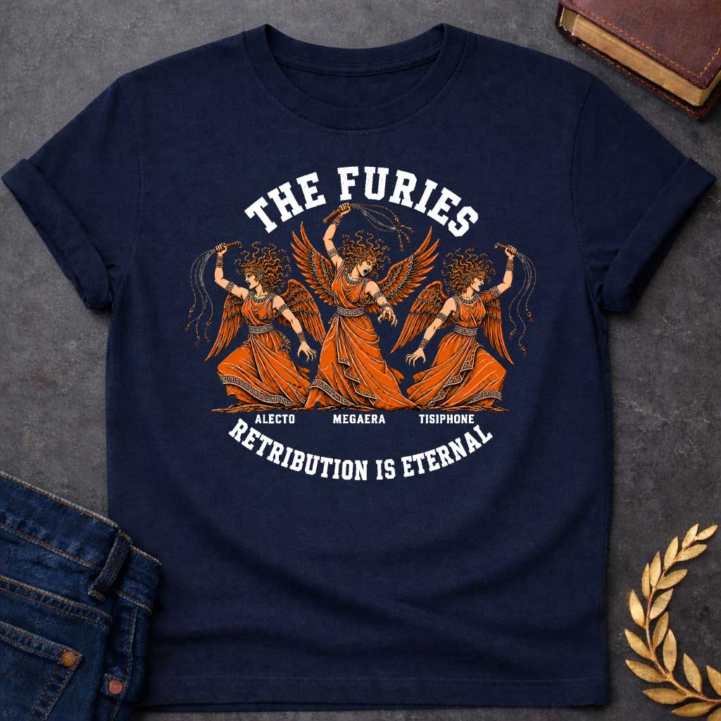 Navy T-shirt with an Illustration of the three Furies, the Greek goddesses of vengeance. Three winged female figures with serpent hair wear orange draped robes with Greek key patterns. Each carries whips as instruments of punishment. Named left to right: Alecto, Megaera, and Tisiphone. Rendered in black and orange with classical details. Text reads 'THE FURIES' above and 'RETRIBUTION IS ETERNAL' below, celebrating divine justice and eternal consequences for wrongdoing.