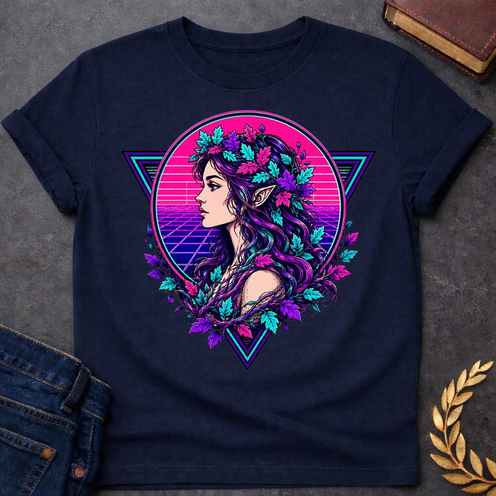 Navy T-shirt with a vibrant 1980s synthwave-style graphic. A stylized dryad silhouette emerges from a geometric wireframe tree, set against a glowing neon pink and cyan sun. The background features a classic retrowave perspective grid and retro palm tree outlines. The vivid color palette combines neon pinks, purples, and electric blues for a retro-futuristic, nostalgic, and high-contrast summer aesthetic.