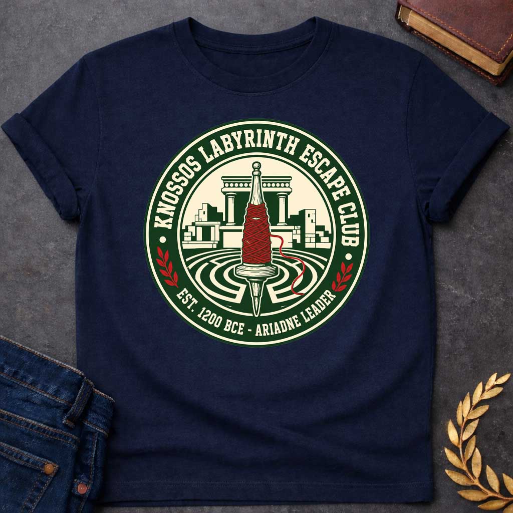 Navy T-shirt with A circular, collegiate-style emblem t-shirt design, The logo features a cream center showing a wooden spindle wrapped in bright red thread, positioned over a labyrinth with ancient Minoan ruins behind it. The dark green outer ring reads "KNOSSOS LABYRINTH ESCAPE CLUB" along the top and "EST. 1200 BCE - ARIADNE LEADER" at the bottom, separated by small red laurel branches.