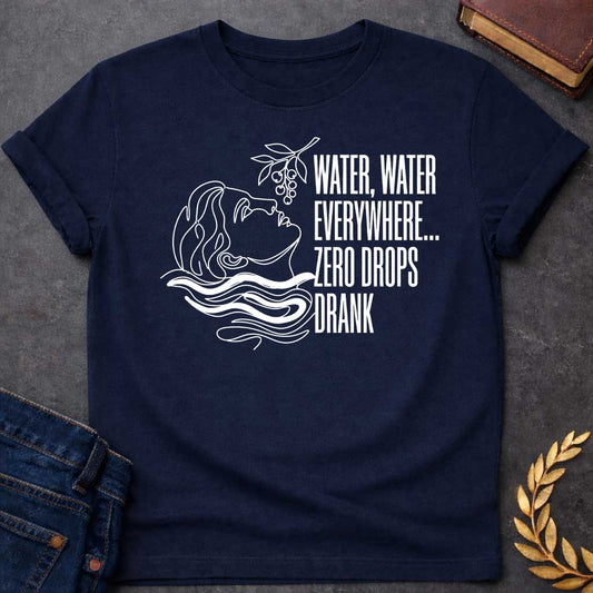 Navy t-shirt with A continuous line-art illustration. Drawn in sleek white outlines with vibrant white water ripples, a classical profile tilts its head back toward a hanging fruit branch just above. Stacked to the right in tall, narrow sans-serif text, the quote reads "WATER, WATER EVERYWHERE... ZERO DROPS DRANK" for a modern, mythological-inspired design.