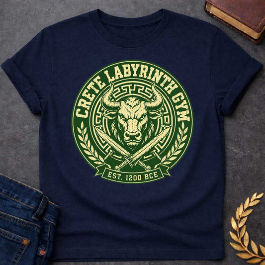 Navy T-shirt with a Fitness emblem of the Minotaur from Crete's Labyrinth. Green and cream circular badge displays a detailed bull head with curved horns within Greek key borders. Two crossed swords flank below. Laurel wreaths frame sides. Text reads 'Crete Labyrinth Gym' and 'Est. 1200 BCE.' Distressed texture adds vintage appeal. Merges Greek mythology with modern gym culture, celebrating legendary warrior strength.
