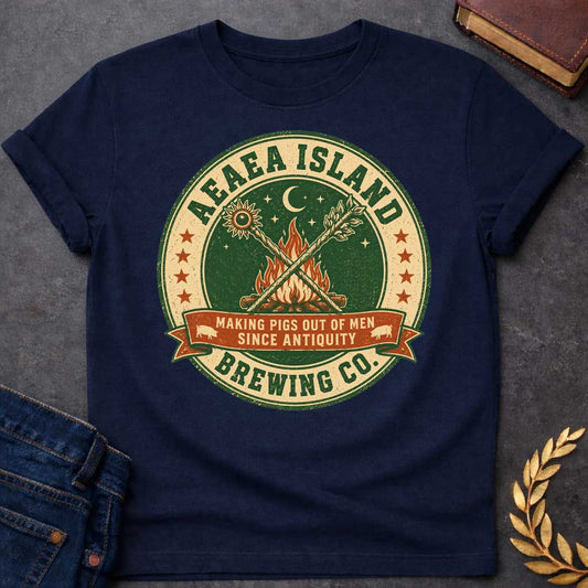 Navy T-shirt with a Humorous brewery emblem of Aeaea Island Brewing Co. in green and cream vintage style. A roaring campfire with crossed torches dominates the center beneath a sun, moon, and stars. Brown banner reads 'Making Pigs Out of Men Since Antiquity' flanked by small pig silhouettes. Red stars border the circular design. Distressed texture adds authentic craft brewery aesthetic. Celebrates Circe's mythological powers of transformation and enchantment with modern craft beer culture.