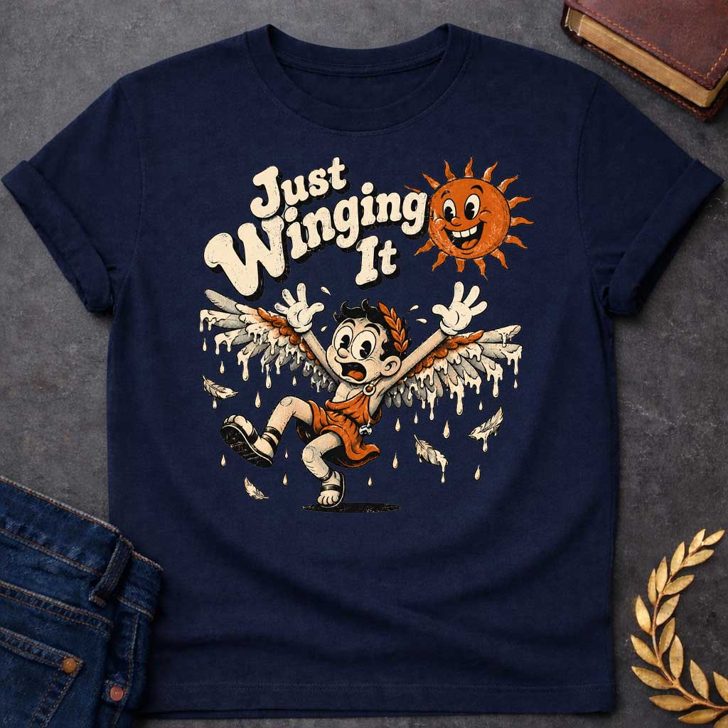 Navy t-shirt with a vintage 1930s rubber-hose cartoon style  design. A panicked boy representing Icarus tumbles through the air with arms raised as his feathered wax wings melt into dripping drops. Above him, a cheerful retro sun character grins mischievously next to playful, bubbly text that reads "Just Winging It" in a distressed cream font.