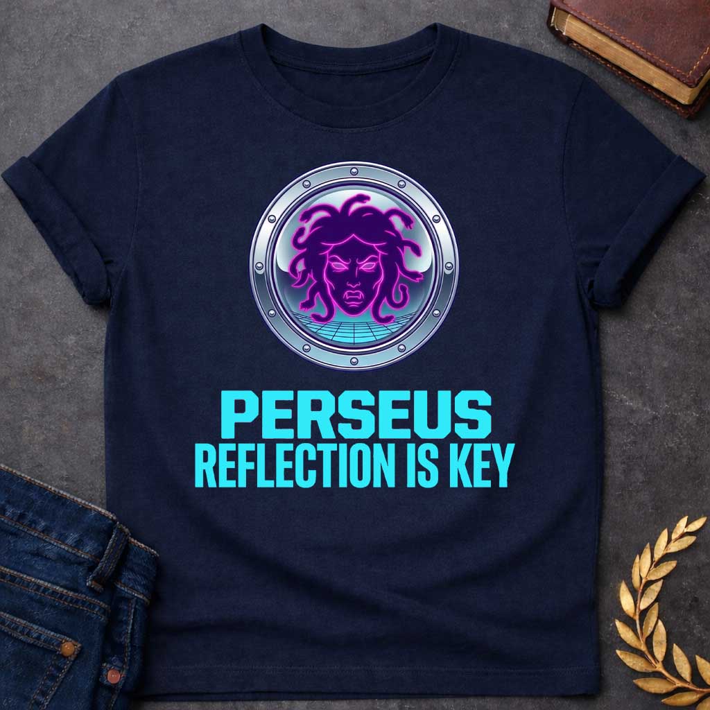 Navy t-shirt in synthwave style: a glowing neon-pink and purple Medusa face with snake hair sits inside a chrome porthole frame with rivets, backed by a retro grid floor and gradient sky. Bold cyan text below reads "Perseus" and "Reflection Is Key"
