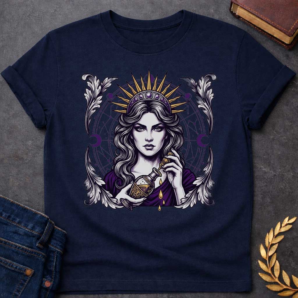 Navy T-shirt with a Mystical portrait of Medea rendered in black, purple, and gold holding an ornate potion vessel with glowing liquid dripping downward. Elaborate celestial backdrop features a radiating golden sun crown, purple moon phases, and astrological constellation patterns surrounding her face. Ornate white wing designs frame the composition. Intricate occult aesthetic celebrates the legendary Greek sorceress's magical power, ancient wisdom, and mystical enchantment.