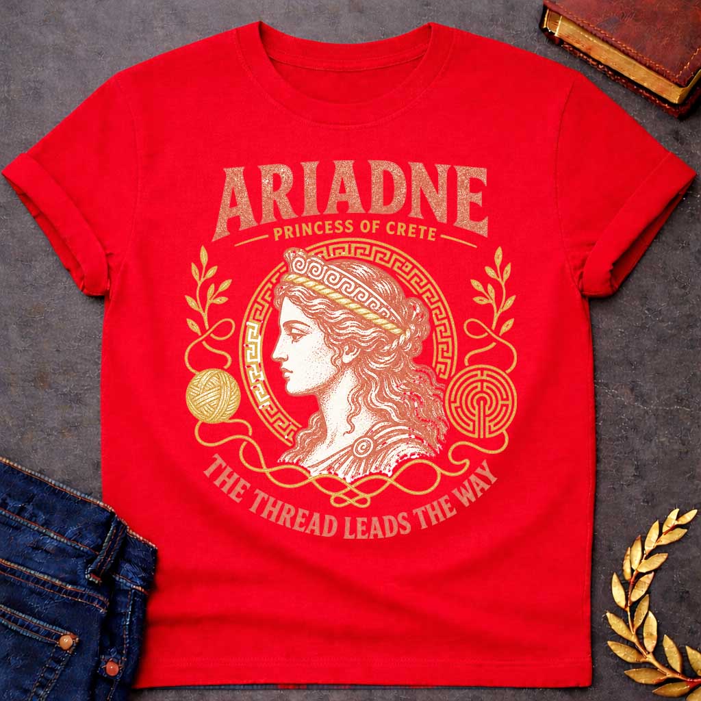 Red t-shirt with a Vintage Greek mythology design featuring Ariadne, Princess of Crete, in a classical portrait framed by a Greek key border, golden thread, yarn, laurel branches, and a labyrinth. Warm coral and gold engraving-style artwork is paired with the phrase "The Thread Leads the Way," inspired by Ariadne's role in helping Theseus escape the Minotaur's labyrinth.
