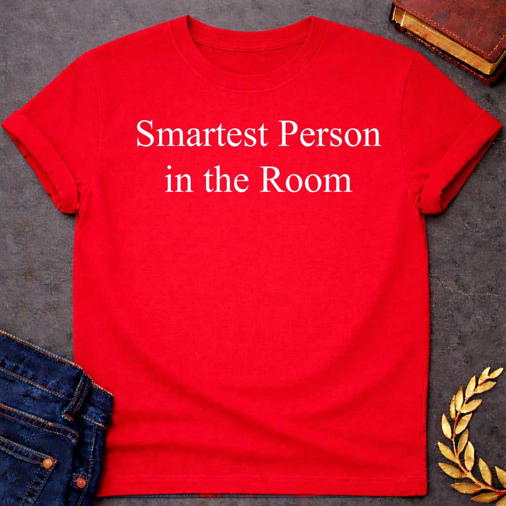 Red T-shirt graphic in white featuring large elegant serif text reading "Smartest Person in the Room" — a confident nod to Athena, the Greek Goddess of Wisdom