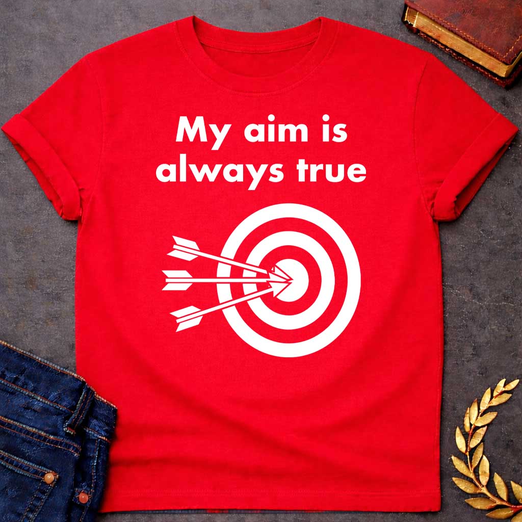 Red T-shirt graphic At the top, the phrase "My aim is always true" is written in a bold, white, sans-serif font across two lines. Below the text is a black and white bullseye target icon. Three white arrows are shown striking the center of the target simultaneously from the left, with their points clustered directly in the "dead center" inner circle