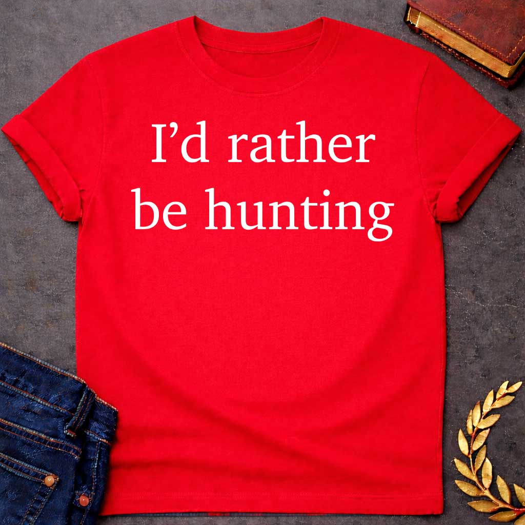 Red T-shirt graphic white featuring large clean serif text reading "I'd rather be hunting" — a humorous nod to Artemis, the Greek Goddess of the Hunt