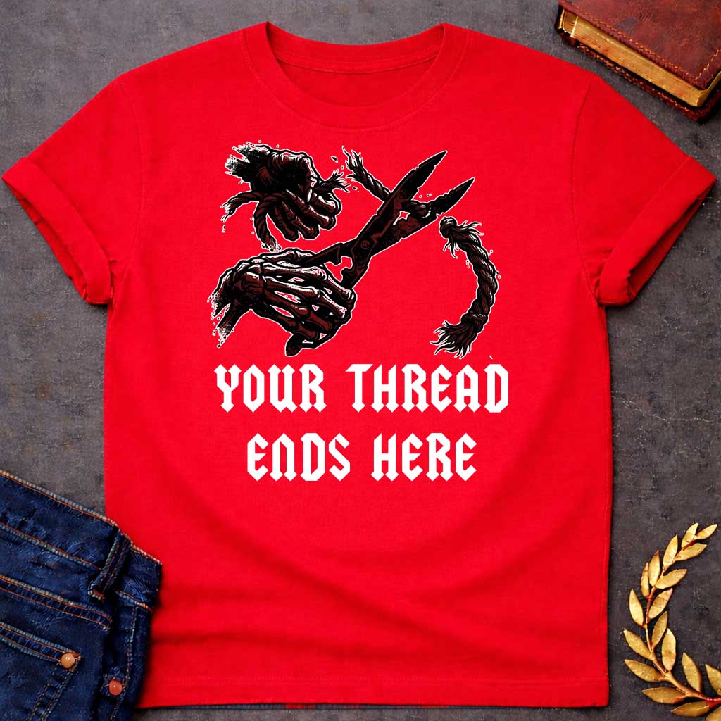 Red T-shirt graphic in black, white, and dark red featuring a dark illustrated scene of two skeletal hands gripping large shears cutting through a thick fraying rope or thread, rendered in a gritty horror-influenced ink style with ink splatter details. Bold heavy metal-style blackletter text below reads "Your Thread Ends Here" — a dark and dramatic reference to Atropos, the eldest of the Moirai, the Greek Fate who cuts the thread of life