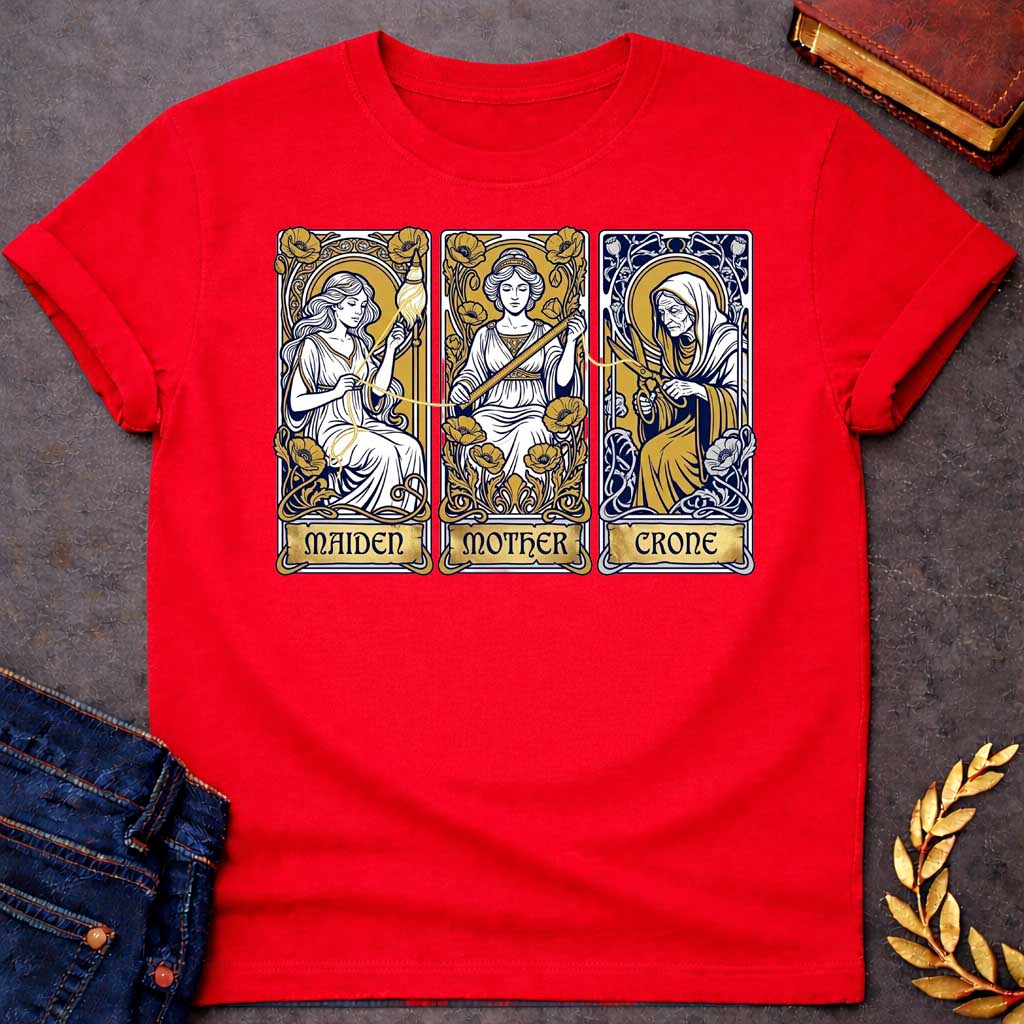 Red T-shirt graphic featuring three Art Nouveau-style tarot card panels in navy, gold, and white, each depicting one of the Moirai, the Greek Fates, as the triple goddess archetypes. The first panel shows the Maiden as a young woman spinning a golden thread from a spindle amid poppies, labelled "Maiden." The middle panel shows the Mother as a composed woman measuring the thread with a ruler surrounded by blooming poppies, labelled "Mother." The third panel shows the Crone as an elderly hooded woman holding 
