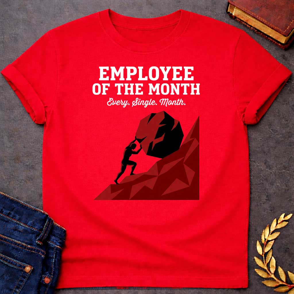 Red T-shirt with a graphic featuring bold dark grey slab serif text reading "Employee of the Month" with a script subtitle reading "Every. Single. Month." above a low-polygon geometric illustration of Sisyphus as a black silhouette straining to push an enormous dark red boulder up a steep angular red hill — a humorous reference to the Greek myth of Sisyphus, condemned to roll a boulder uphill for eternity