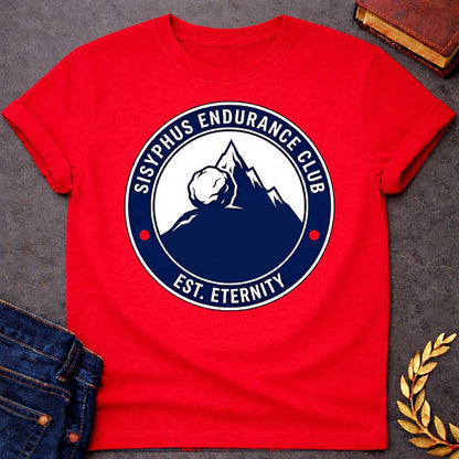 Red T-Shirt with a circular, emblem-style graphic design. The center features a dark blue silhouette of a mountain with a large boulder resting near the peak. Surrounding this illustration is a dark blue ring with white text that reads "SISYPHUS ENDURANCE CLUB" arched at the top and "EST. ETERNITY" at the bottom, with two small red dots separating the text on the sides.