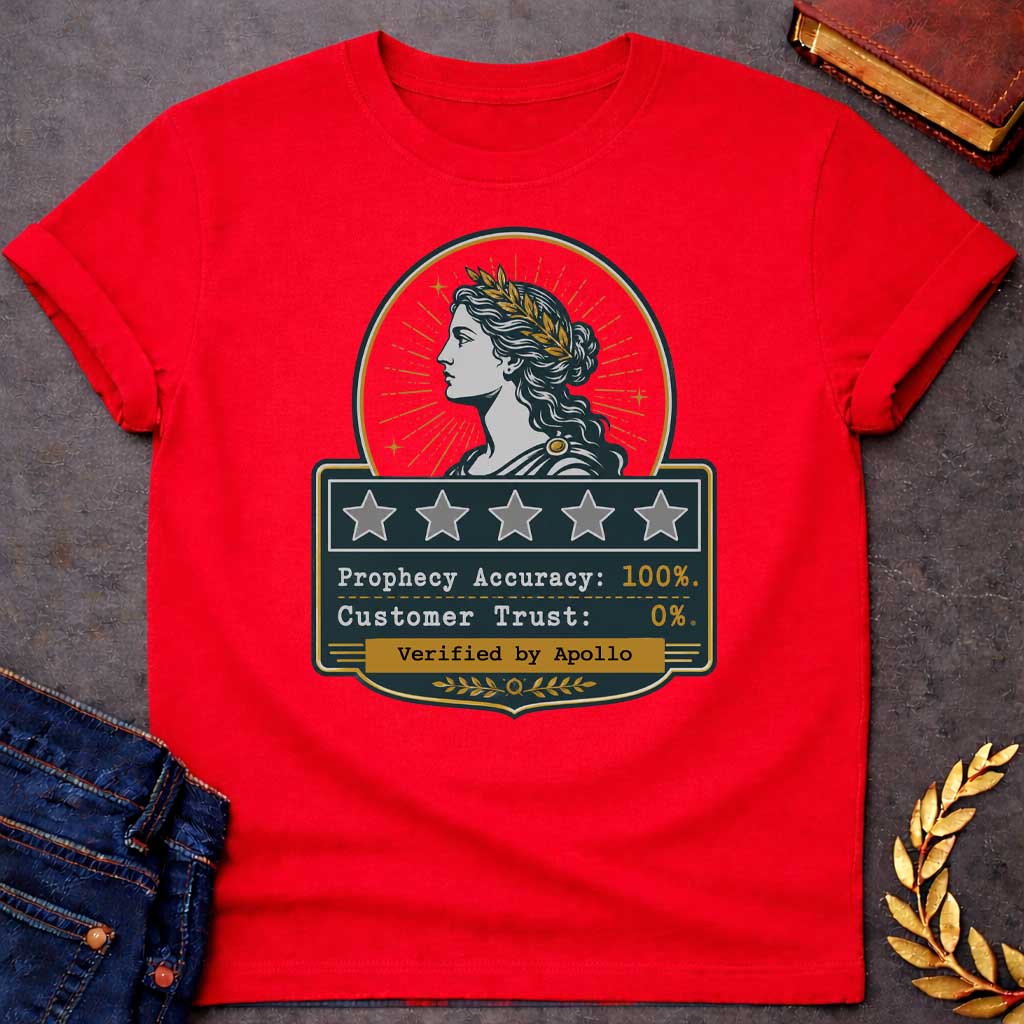 Red T-shirt with a satirical Greek mythology badge referencing Cassandra. The top features a vector profile of a woman wearing a gold laurel wreath with a radiant sunburst behind her. Below, a dark plaque displays five empty review stars. The text reads: "Prophecy Accuracy: 100%." and "Customer Trust: 0%." in a typewriter font. A gold banner at the bottom is stamped with "Verified by Apollo."
