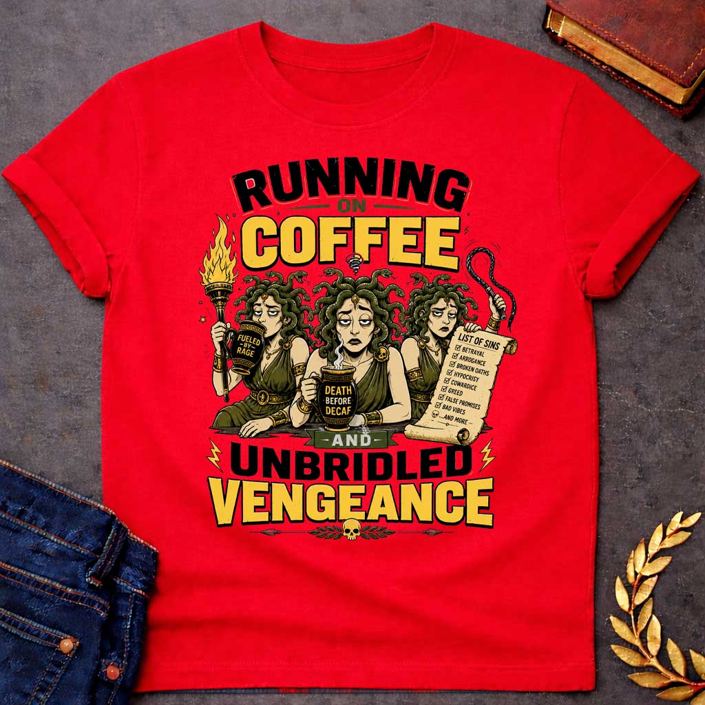 Red T-shirt with a Humorous illustration blending Greek mythology with coffee culture. Three Furies with serpent hair wear classical robes holding symbols of vengeance. Left holds a flaming torch labeled 'Fueled by Rage,' center holds a coffee cup reading 'Death Before Decaf,' right carries a scroll listing sins. Text reads 'Running on Coffee and Unbridled Vengeance' above and below. Gold and black scheme celebrates divine justice powered by caffeine addiction.