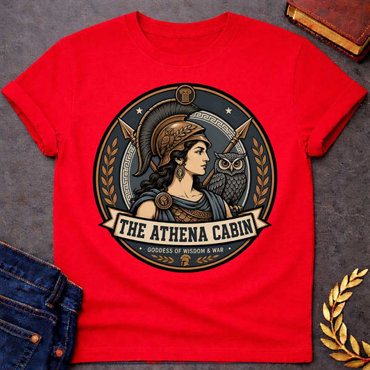 Red t-shirt with a Athena Greek mythology cabin design featuring the goddess of wisdom and war in a bronze warrior helmet, accompanied by her sacred owl and crossed spears. Bronze, charcoal, and cream circular camp-style emblem features Greek key details, laurel branches, and the text “The Athena Cabin” and “Goddess of Wisdom & War.”