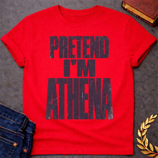 Red t-shirt with a Pretend I’m Athena Greek mythology design featuring bold distressed purple typography on a transparent background. The stacked text reads “PRETEND I’M ATHENA” in a rugged vintage block font, creating a humorous design inspired by Athena, the Greek goddess of wisdom, warfare, strategy, and crafts.