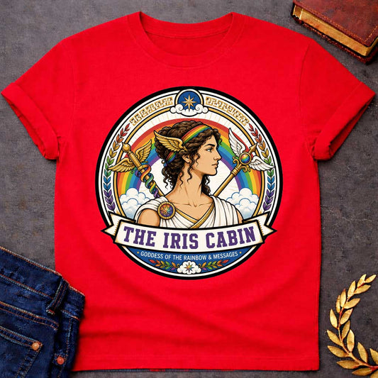 Red T-shirt with a Iris Greek mythology cabin design featuring the goddess of the rainbow and messages in a colorful circular emblem. Iris wears a rainbow headband and winged accents, surrounded by a vibrant rainbow, clouds, winged staffs, laurel leaves, and celestial details. Text reads “The Iris Cabin” and “Goddess of the Rainbow & Messages,”