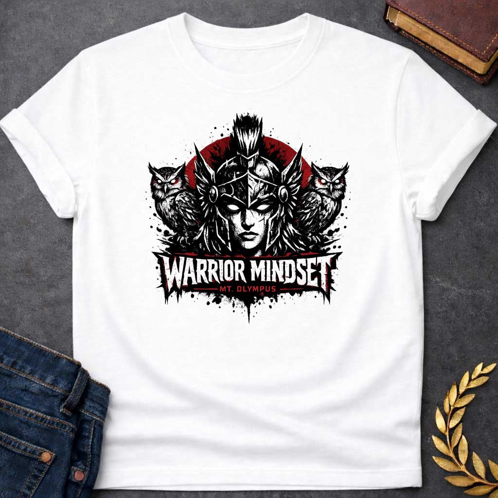 White T-shirt graphic in a dark, intense ink style featuring a front-facing illustration of Athena in a winged helmet against a deep red circle, flanked by two owls with glowing red eyes. Bold distressed text below reads "Warrior Mindset" with "Mt. Olympus" in red underneath, in a heavy metal-inspired Greek mythology design rendered in black, white, and red