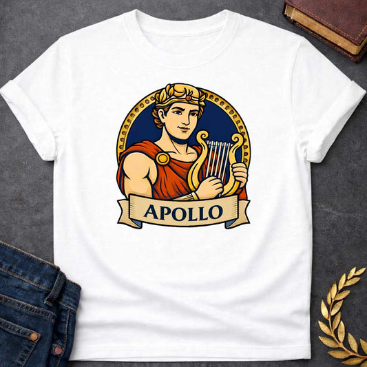 White T-shirt graphic featuring a vibrant illustrated portrait of Apollo, the Greek God of the Sun and Music, with short curly hair and a gold laurel crown, wearing a red draped robe fastened with a gold brooch, playing a golden lyre. He is framed within a gold circular border against a navy background, with a scroll banner below reading "Apollo," in a bold tattoo-inspired style with navy, gold, and red tones