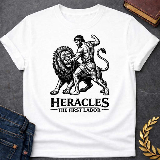 White T-shirt. The illustration features a woodcut-style depiction of the Greek hero Heracles wrestling the Nemean lion. Below the artwork, the text reads in black "HERACLES" in a large, distressed serif font, followed by the smaller subtitle "THE FIRST LABOR,"