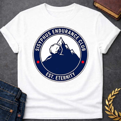 White T-Shirt with a circular, emblem-style graphic design. The center features a dark blue silhouette of a mountain with a large boulder resting near the peak. Surrounding this illustration is a dark blue ring with white text that reads "SISYPHUS ENDURANCE CLUB" arched at the top and "EST. ETERNITY" at the bottom, with two small red dots separating the text on the sides.
