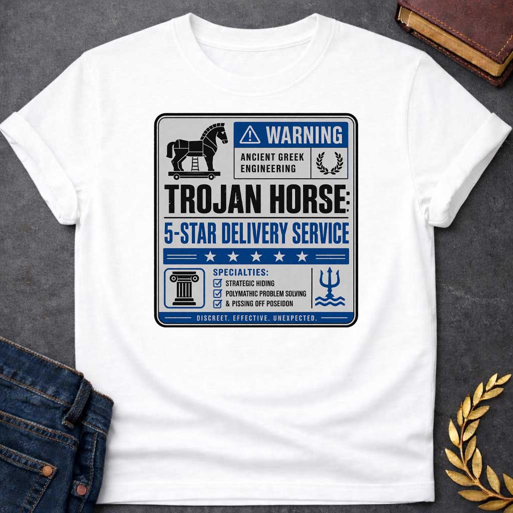 White T-shirt with a graphic designed as a humorous official-style warning sign in grey, blue, and black featuring a flat Trojan Horse icon with a blue warning triangle and the text "Warning — Ancient Greek Engineering" and a laurel wreath in the top section. Bold text reads "Trojan Horse: 5-Star Delivery Service" above a blue five-star rating banner. A checklist below under "Specialties:" reads "Strategic Hiding, Polymathic Problem Solving, & Pissing Off Poseidon" flanked by a Greek column icon and a Posei
