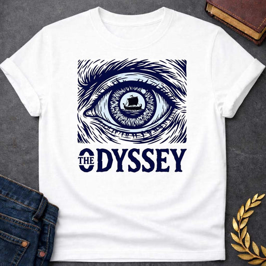 White T-Shirt with a dramatic graphic design for 'The Odyssey' featuring a stylized eye in navy blue and white. The iris contains a silhouette of an ancient Greek ship with a single sail, surrounded by radiating lines suggesting both an iris pattern and oceanic waves. Swirling, turbulent linework evokes stormy seas and Odysseus's tumultuous journey. Bold serif text reads 'THE ODYSSEY' in navy blue. Combines classical maritime imagery with modern design, emphasizing vision, journey, destiny, and fate.