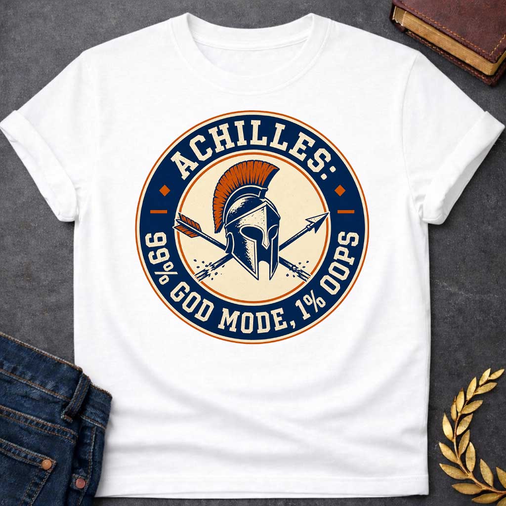 White T-Shirt with a circular badge design in navy blue, cream, and burnt orange featuring a Greek Corinthian helmet with orange horsehair crest, crossed by two arrows. Styled like a vintage achievement badge. Text reads 'ACHILLES:' at top, '99% GOD MODE, 1% OOPS' at bottom. Humorously references Achilles and his famous vulnerability—his heel—suggesting he was nearly invincible (99% in 'god mode') except for one fatal weakness (1% 'oops'). Distressed, retro aesthetic mimics vintage sports or gaming badges.